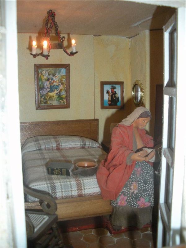 donna allatta bimbo sul letto